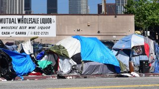 Tents housing the homeless line a street in downtown Los Angeles.
