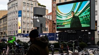 A screen displays Ermenegildo Zegna's digital Fall/Winter 2021 Men's fashion collection