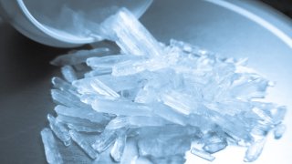 Close-Up Of Methamphetamine Jar On Table