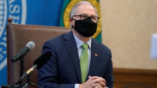 Washington Gov. Jay Inslee listens to a question during a news conference Monday, Jan. 18, 2021, at the Capitol in Olympia, Washington.