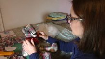 Designer Karla Cantero works on a Memory Bear.