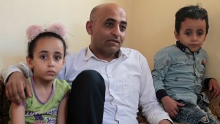 Anwar Alsaeedi sits with his children at his home in Sanaa, Yemen, Thursday, Jan. 28, 2021. Alsaeedi, who had hoped to provide his two children with a better future, said he rejoiced in 2017 when he was picked for the lottery’s “diversity visa” interview. Then he was ineligible due to the Trump administration’s travel ban that affected several Muslim-majority nations. “Our country is embroiled in wars and crises and we’ve lost everything,” he said. “Making it to America is a big dream.”
