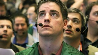 Traders watch prices in the Ten-Year Treasury Note options pit at the CME Group.