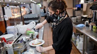 Wyomissing Restaurant and Bakery Food Specialist Megan Catarious, prepares a crepe at the crepe bar at the Wyomissing Restaurant and Bakery on Penn Ave in Wyomissing, Pennsylvania, January 22, 2021.