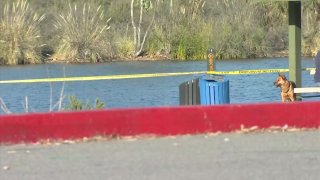 Caution tape blocks off access to a portion of Lake Murray after authorities recovered the body of a woman from the water on Sunday, Feb. 7, 2021.