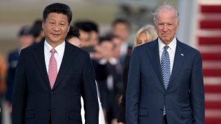 Chinese President Xi Jinping and Vice President Joe Biden walk down the red carpet on the tarmac during an arrival ceremony in Andrews Air Force Base, Md., Thursday, Sept. 24, 2015. Chinese President Xi Jinping and his wife Peng Liyuan are traveling to Washington for a State Visit.