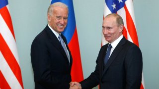 FILE - In this March 10, 2011, file photo, then-Vice President Joe Biden, left, shakes hands with Russian Prime Minister Vladimir Putin in Moscow, Russia. Russia and the United States exchanged documents Tuesday Jan. 26, 2021, to extend the New START nuclear treaty, their last remaining arms control pact, the Kremlin said. The Kremlin readout of a phone call between U.S. President Joe Biden and Russian President Vladimir Putin said they voiced satisfaction with the move.
