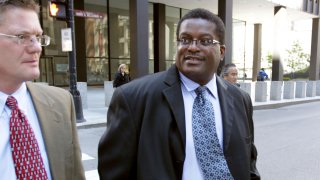 Former Chicago police Sgt. Ronald Watts, right, leaves the Dirksen U.S. Courthouse after being sentenced to 22 months in prison in 2013.