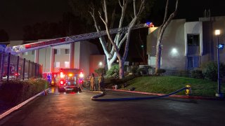 Fire engines outside of an apartment complex where a fire was reported