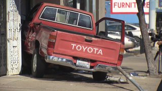 A pickup truck crashed into a storefront in City Heights after it was t-boned in an intersection.
