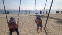 A couple of tots swing at Fanuel Street Park in San Diego in 2016.