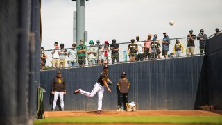 PEORIA, AZ – MARCH 07: Fans watch pitcher Yu Darvish #11 of the San Diego Padres warm up in the bullpen against the Kansas City Royals at the Peoria Sports Complex on March 7, 2021 in Peoria, Arizona. (Photo by Matt Thomas/San Diego Padres/Getty Images)