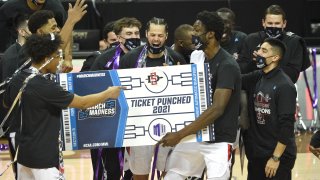 LAS VEGAS, NEVADA – MARCH 13: The San Diego State Aztecs celebrate their 68-57 victory over the Utah State Aggies in the championship game of the Mountain West Conference basketball tournament at the Thomas & Mack Center on March 13, 2021 in Las Vegas, Nevada. (Photo by David Becker/Getty Images)