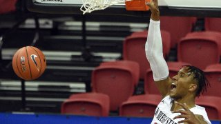 LAS VEGAS, NEVADA – MARCH 13: Joshua Tomaic #23 of the San Diego State Aztecs dunks against the Utah State Aggies during the championship game of the Mountain West Conference basketball tournament at the Thomas & Mack Center on March 13, 2021 in Las Vegas, Nevada. (Photo by David Becker/Getty Images)