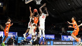 INDIANAPOLIS, INDIANA – MARCH 19: Kadary Richmond #3 of the Syracuse Orange shoots between Nathan Mensah #31, Matt Mitchell #11, and Terrell Gomez #3 of the San Diego State Aztecs during the first half in the first round game of the 2021 NCAA Men’s Basketball Tournament at Hinkle Fieldhouse on March 19, 2021 in Indianapolis, Indiana. (Photo by Andy Lyons/Getty Images)
