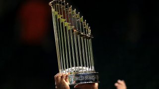 Who’s going to hoist the Commissioner’s Trophy as World Series champs this year? (Photo by Cooper Neill/MLB Photos via Getty Images)