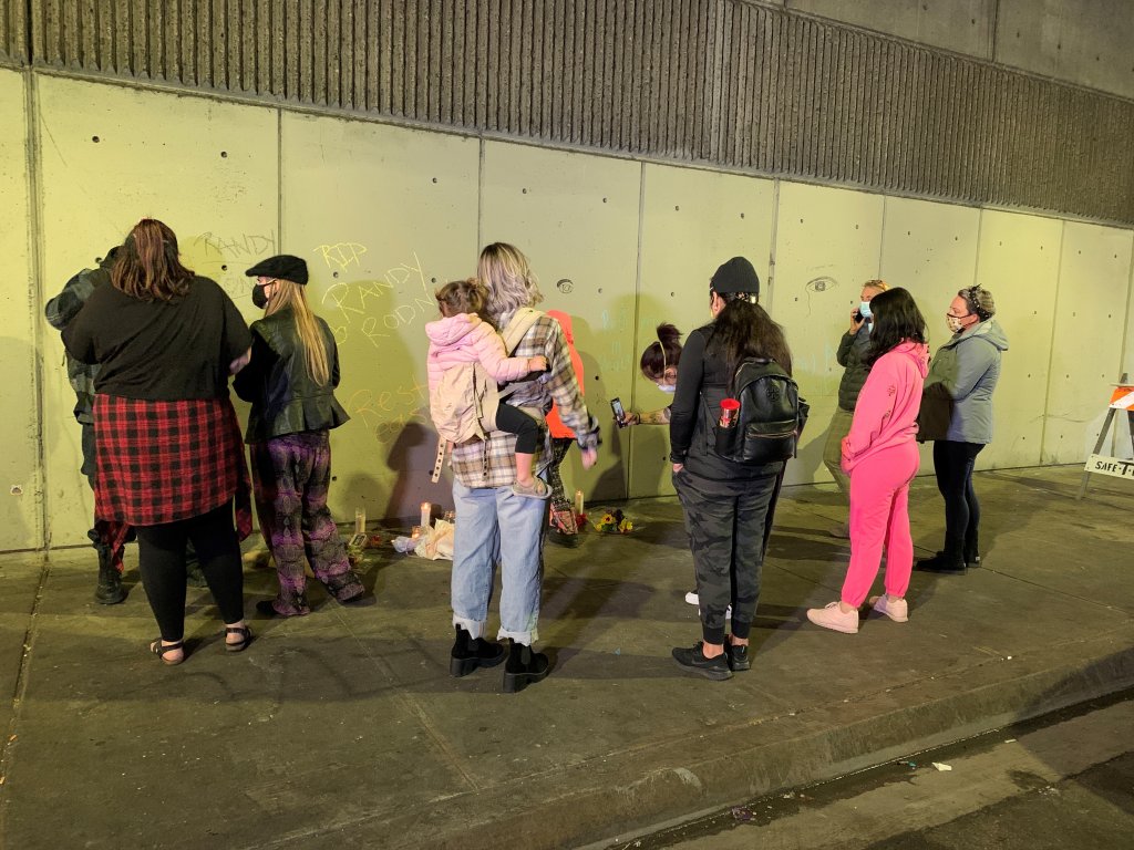 A small vigil forms at the site of the deadly crash near San Diego City College on March 15, 2021