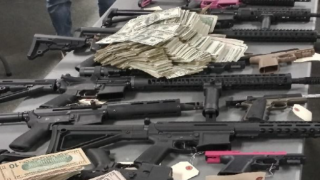 Guns and cash seized from a home in Normal Heights.