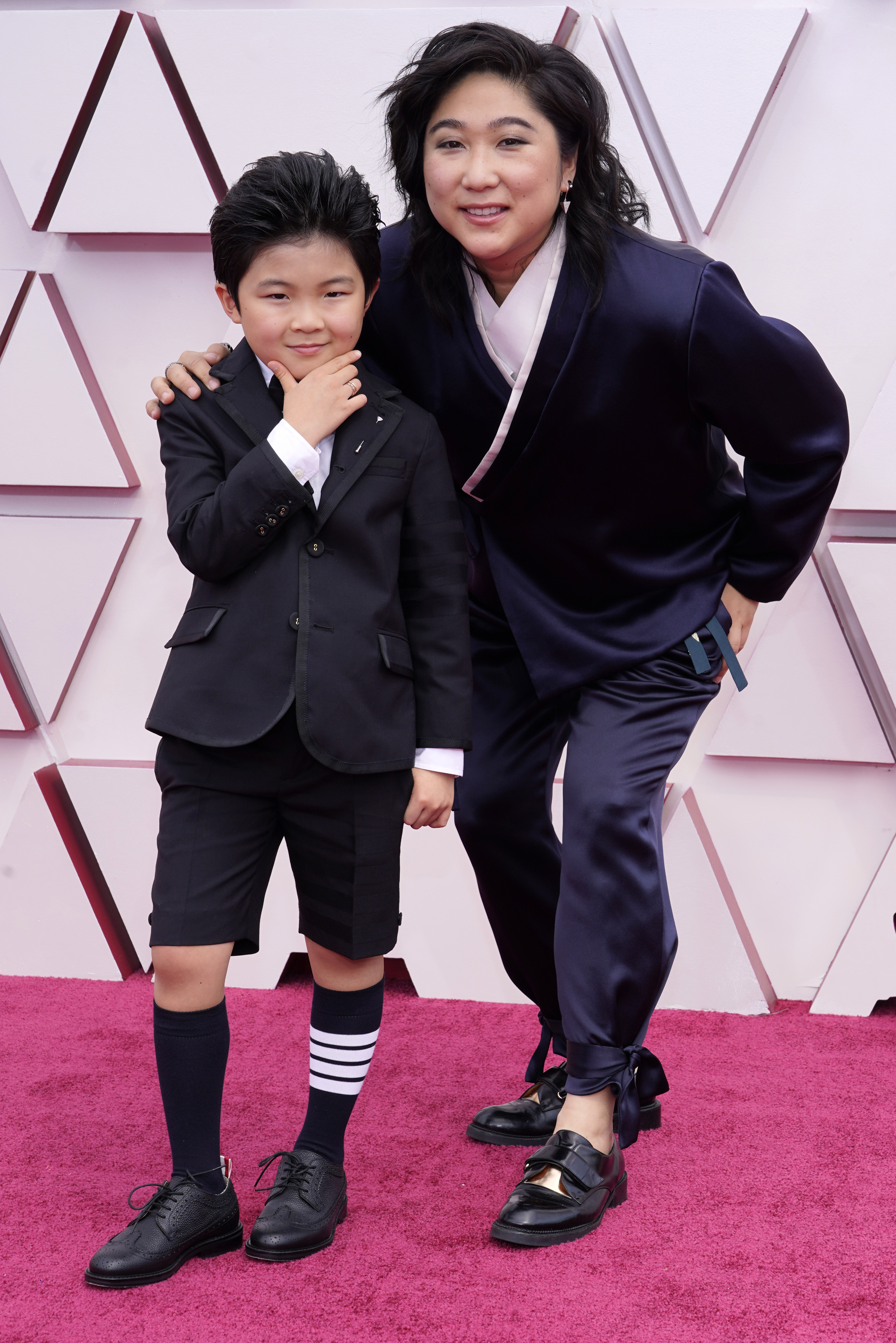 EMPTY_CAPTION"Minari" star Alan S. Kim, left, and Vicky Kim show off their looks at the Oscars.