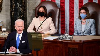 President Joe Biden addresses a joint session of Congress, Wednesday, April 28, 2021, in the House Chamber at the U.S. Capitol in Washington, as Vice President Kamala Harris, left, and House Speaker Nancy Pelosi of Calif., look on.
