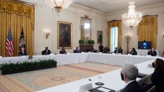 US President Joe Biden (L) holds his first cabinet meeting in the East Room of the White House in Washington, DC, on April 1, 2021.