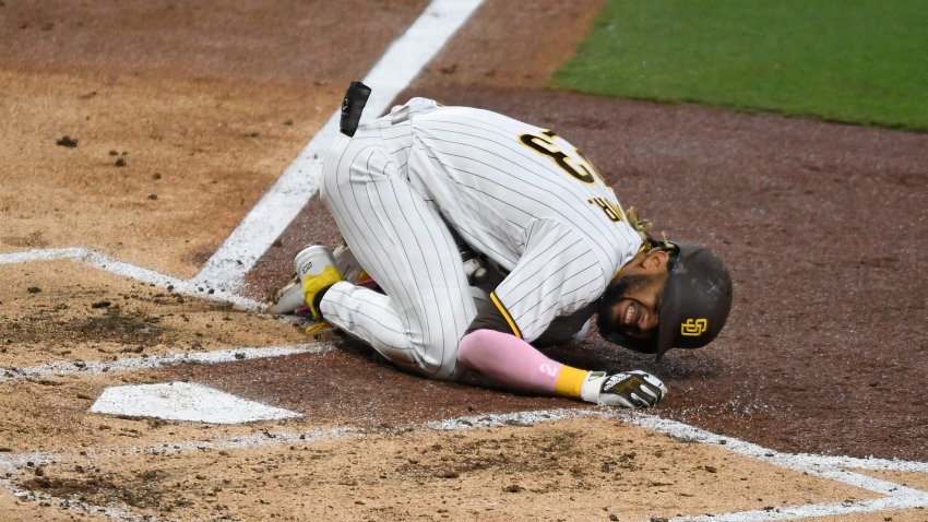 SAN DIEGO, CA – APRIL 5: Fernando Tatis Jr. #23 of the San Diego Padres grimaces in pain after taking a swing during the third inning of a baseball game against the San Francisco Giants at Petco Park on April 5, 2021 in San Diego, California.  (Photo by Denis Poroy/Getty Images)