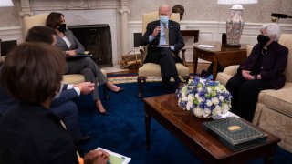 US President Joe Biden speaks as US Vice President Kamala Harris (center L), Janet Yellen (R), Secretary of the Treasury; Cecilia Rouse (L), Chair of the Council of Economic Advisers; and Brian Deese (2L), Director of the National Economic Council look on during the weekly economic briefing in the Oval office of the White House in Washington, DC, on April 9, 2021.