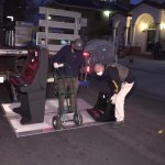 Federal authorities prepare to load a confiscated slot machine onto an evidence van on Wednesday, April 14, 2021.