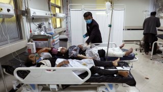 Afghan school students are treated at a hospital after a bomb explosion near a school in west Kabul