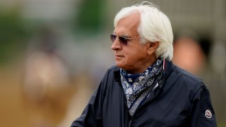 File: Trainer Bob Baffert watches workouts at Churchill Downs Wednesday, April 28, 2021, in Louisville, Kentucky.