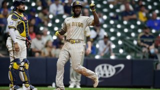 MILWAUKEE, WISCONSIN – MAY 25: Jurickson Profar #10 of the San Diego Padres crosses home plate on a single by Eric Hosmer in the sixth inning against the Milwaukee Brewers at American Family Field on May 25, 2021 in Milwaukee, Wisconsin. (Photo by John Fisher/Getty Images)