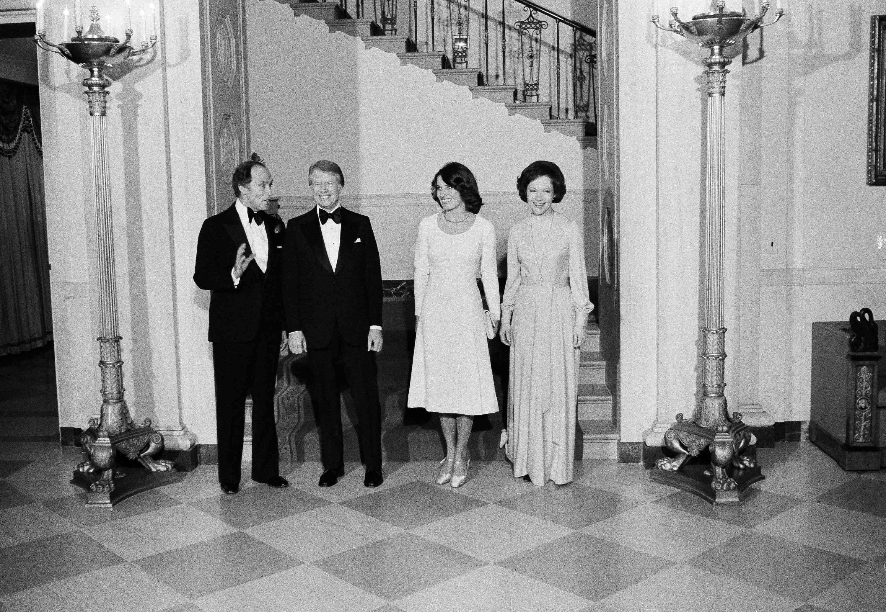 President Jimmy Carter and first lady Rosalynn Carter stand with Canadian Prime Minister Pierre Trudeau and his wife Margaret, at the White House in Washington, Feb. 21, 1977. Carter hosted a State Dinner for the visiting Canadian leader.