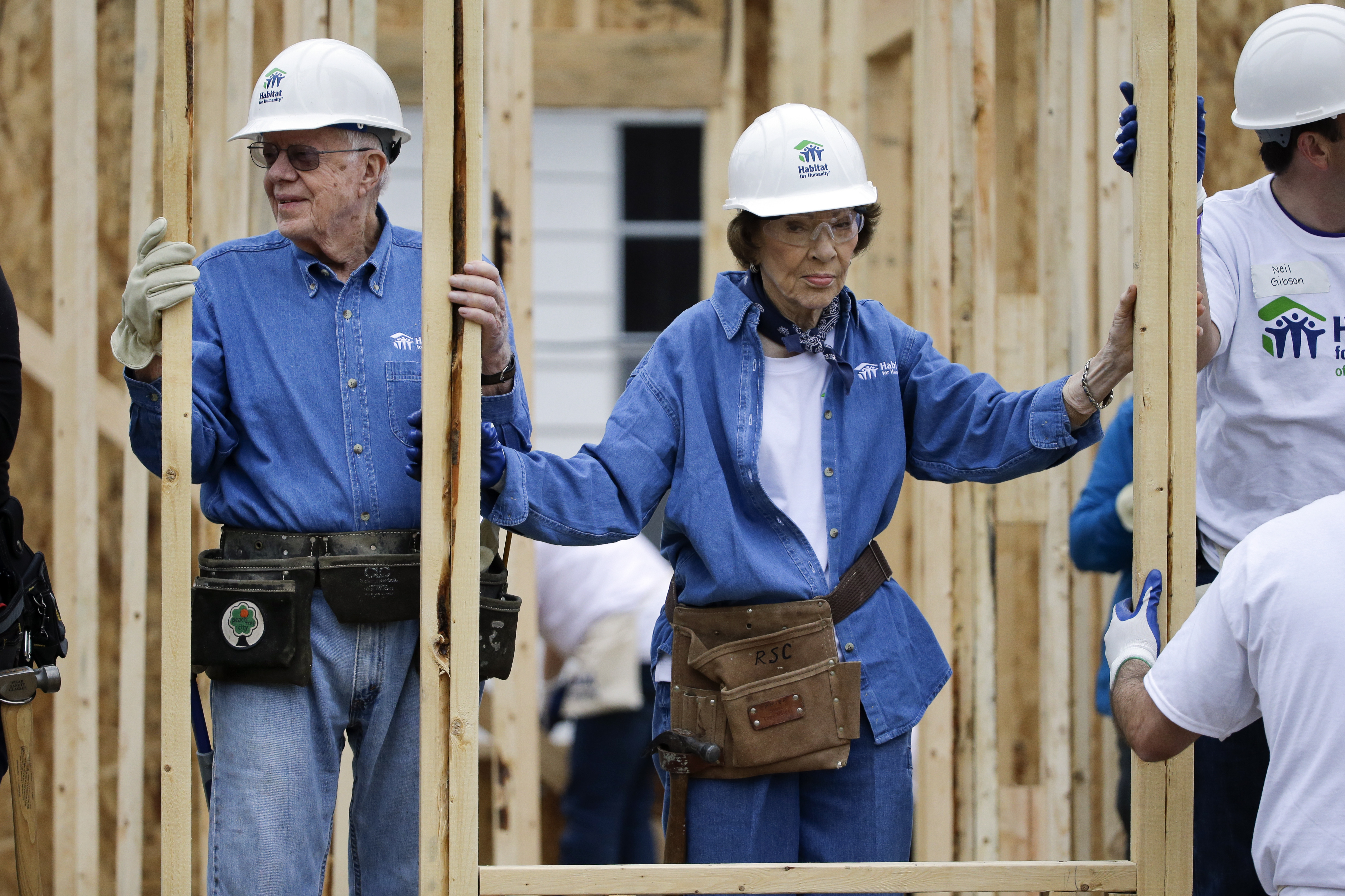 Former President Jimmy Carter, left, and his wife, Rosalynn Carter, work at a Habitat for Humanity building site Monday, Nov. 2, 2015, in Memphis, Tenn. Carter and his wife, Rosalynn, have volunteered a week of their time annually to Habitat for Humanity since 1984, events dubbed “Carter work projects” that draw thousands of volunteers.