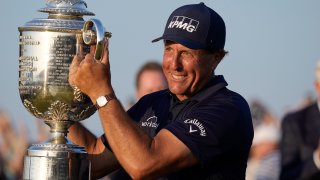 Phil Mickelson holds the Wanamaker Trophy after winning the PGA Championship golf tournament on the Ocean Course, Sunday, May 23, 2021, in Kiawah Island, South Carolina.