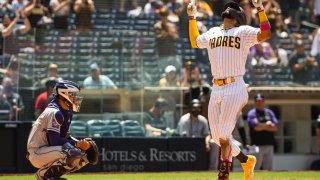 SAN DIEGO, CA – MAY 19: Fernando Tatis Jr. #23 of the San Diego Padres celebrates at home plate after hitting a home run in the fourth inning against the Colorado Rockies at Petco Park on May 19, 2021 in San Diego, California. (Photo by Matt Thomas/San Diego Padres/Getty Images)