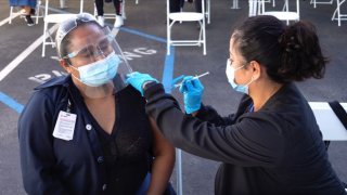 A woman received a COVID-19 vaccine.