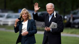 U.S. President Joe Biden waves as he and First Lady Jill Biden