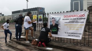 Family of Ricardo Valdes, who disappeared on the road on May 25, put up posters with their photography during a protest in Monterrey, Nuevo Leon state, Mexico.