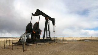 FILE - This Feb. 26, 2021, file photo shows an oil well east of Casper, Wyo. President Joe Biden shut down oil and gas lease sales from the nation's vast public lands and waters in his first days in office, citing worries about climate change. Now his administration has to figure out what do with the multi-billion dollar program without crushing a significant sector of the U.S. economy, while fending off sharp criticism from congressional Republicans and the oil industry.