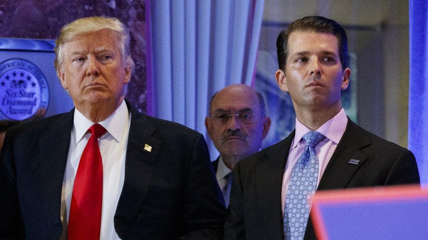 In this Jan. 11, 2017, shows President-elect Donald Trump, left, his chief financial officer Allen Weisselberg, center, and his son Donald Trump Jr., right, attend a news conference in the lobby of Trump Tower in New York.
