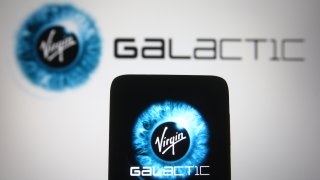 Photo illustration of the Virgin Galactic logo.
