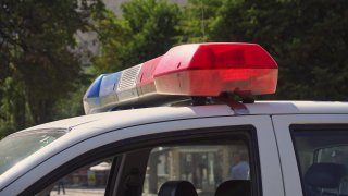 The roof-mounted lightbar of a police car. Close-up shot