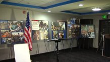 Images of the fallen are displayed on Thursday, July 29, 2021 at a press conference announcing a lawsuit against AAV manufacturer BAE Systems.