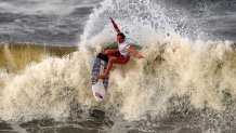 Carissa Moore, of the United States, preforms on the wave during the gold medal heat in the women's surfing competition at the 2020 Summer Olympics, Tuesday, July 27, 2021, at Tsurigasaki beach in Ichinomiya, Japan.