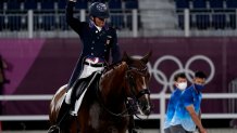 The United States' Steffen Peters, riding Suppenkasper, reacts after competing in the equestrian dressage team final at the 2020 Summer Olympics, Tuesday, July 27, 2021, in Tokyo.