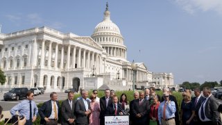 Representative Josh Gottheimer, a Democrat from New Jersey and co-chair of the House Problem Solvers Caucus, center, speaks during a news conference outside the U.S. Capitol in Washington, D.C., U.S., on Friday, July 30, 2021.