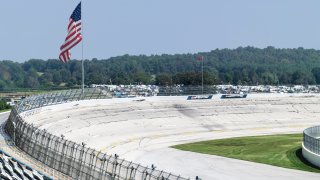 This file image shows a general view of an empty race track and American flag.