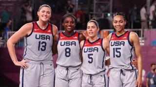 Stefanie Dolson, Jacquelyn Young, Kelsey Plum and Allisha Gray of Team United States pose for a portrait after winning the gold medal in the 3x3 Basketball competition on day five of the Tokyo 2020 Olympic Games at Aomi Urban Sports Park on July 28, 2021 in Tokyo, Japan.