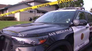 San Diego police respond to the scene of a homicide investigation after a man was found dead in an Otay Mesa apartment by his girlfriend on Thursday, July 8, 2021.