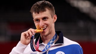 Gold medalist Vladislav Larin of Team ROC poses with the gold medal for the Men's +80kg Taekwondo on day four of the Tokyo 2020 Olympic Games